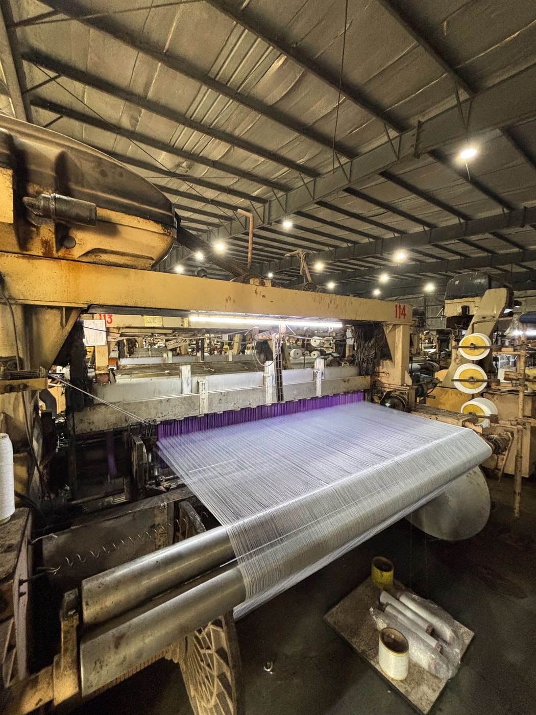 Water-jet looms running on the Anubha Fabrics floor in Surat