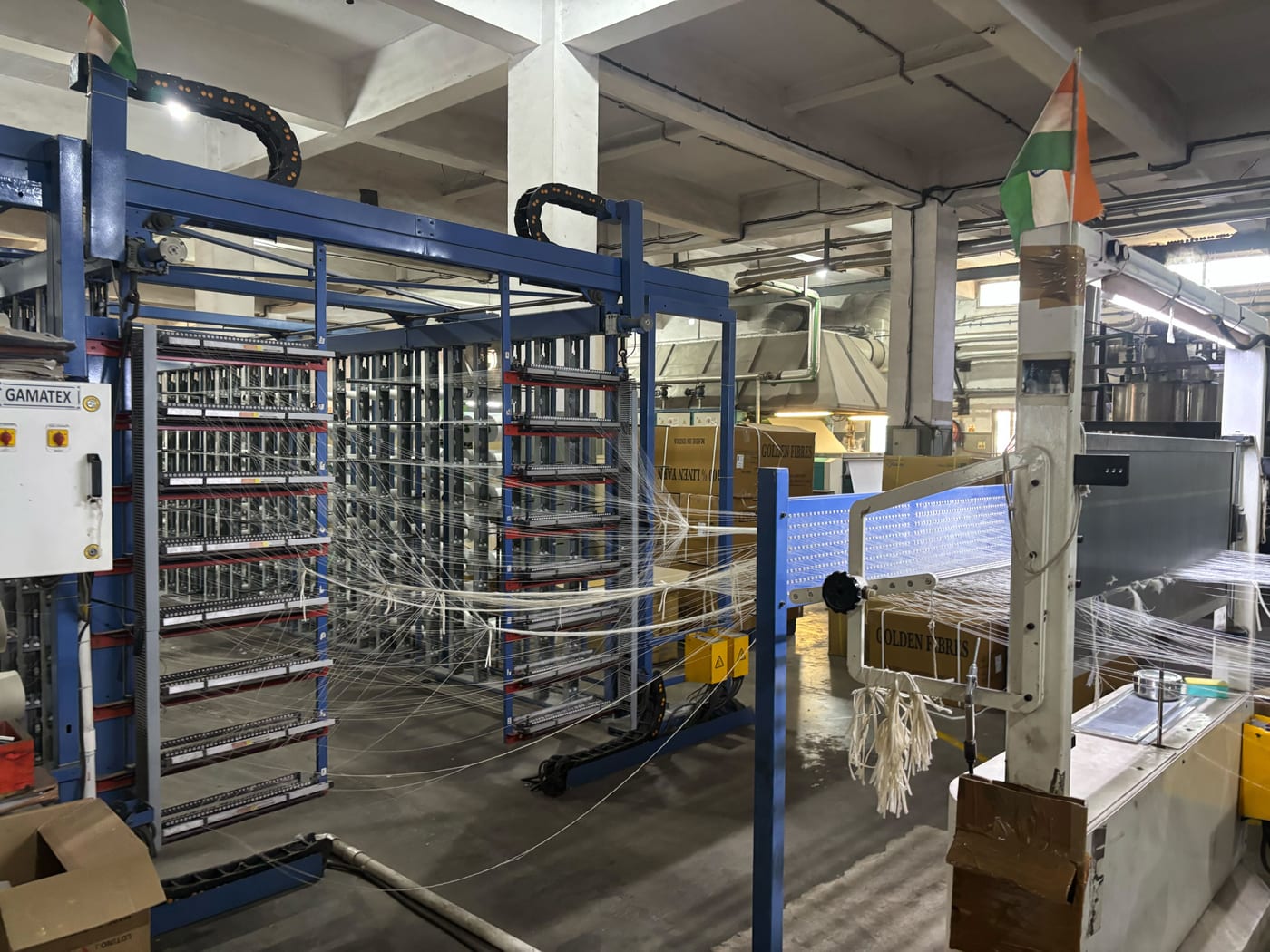 Gamatex twisting machine with yarn threads at the Kottex Industries twisting unit